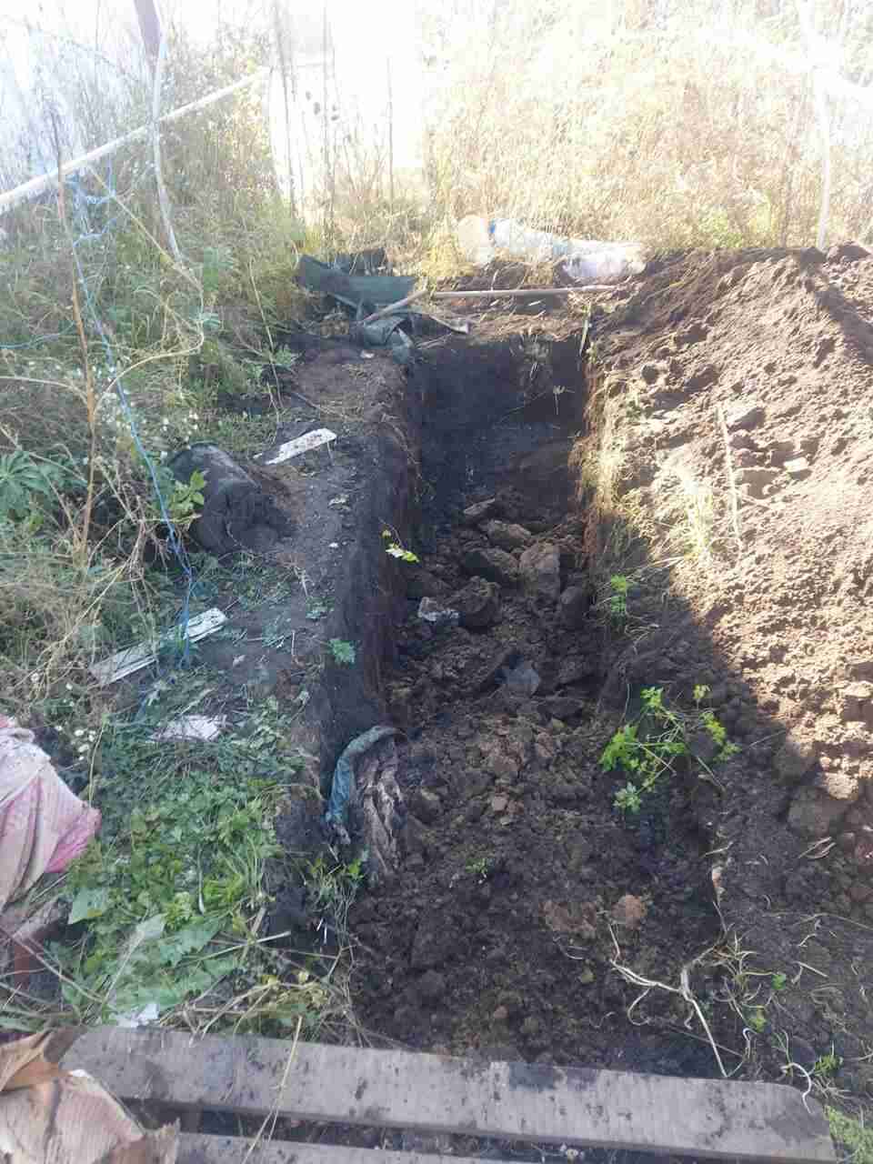 На Харківщині знайшли ще тіла мирних мешканців, один із них - без голови (ФОТО)